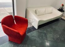 Used Cherry Red Lounge Chair, White Sofa, & Glass Top & Black Side Tables