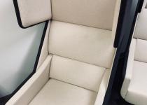 Used Cream Swiveling Lounge Chair