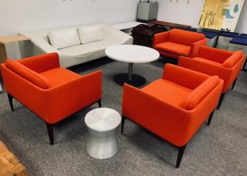 Used Cherry Red Lounge Chairs, White Couch, White Round Coffee Table, & Silver Side Table
