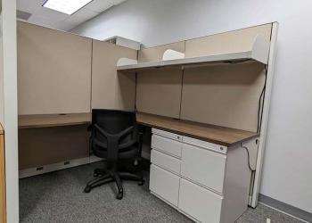 High wall cubicle with woodgrain desk