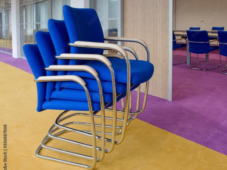 Blue stackable chairs in the office