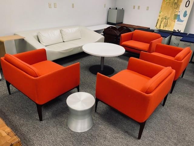 Used Cherry Red Lounge Chairs, White Couch, White Round Coffee Table, & Silver Side Table